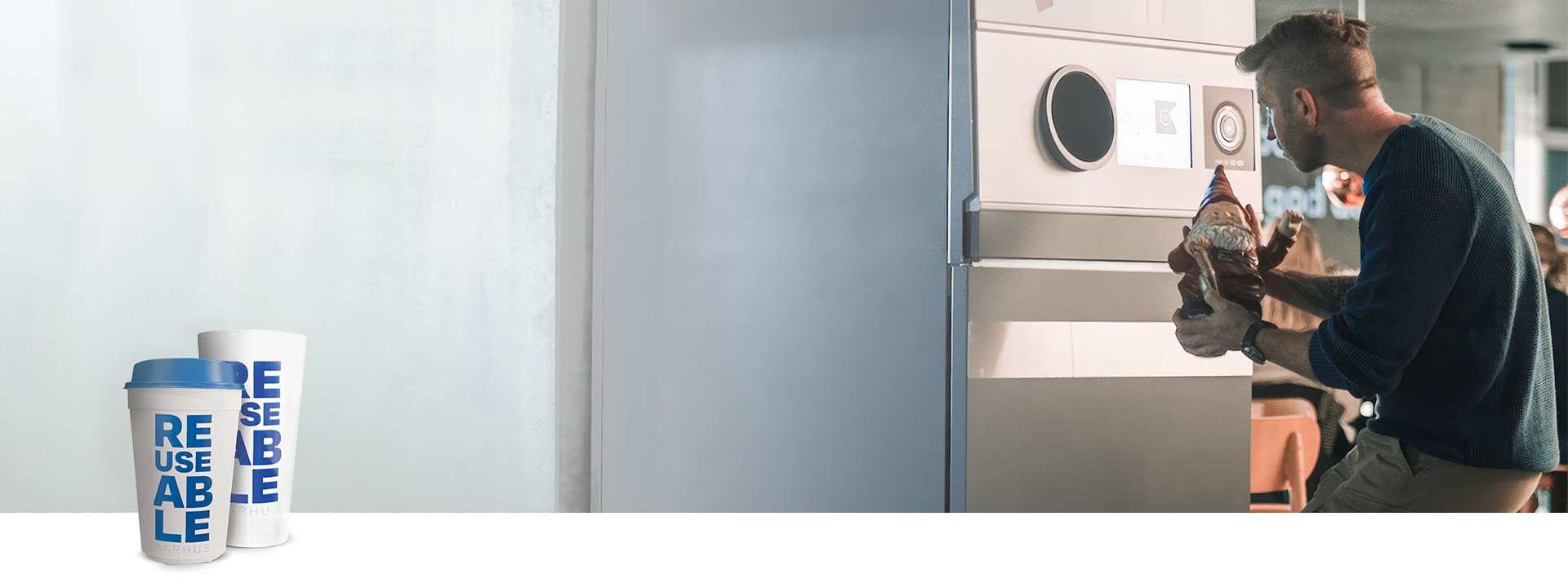 reusable cup logo and man holding garden gnome