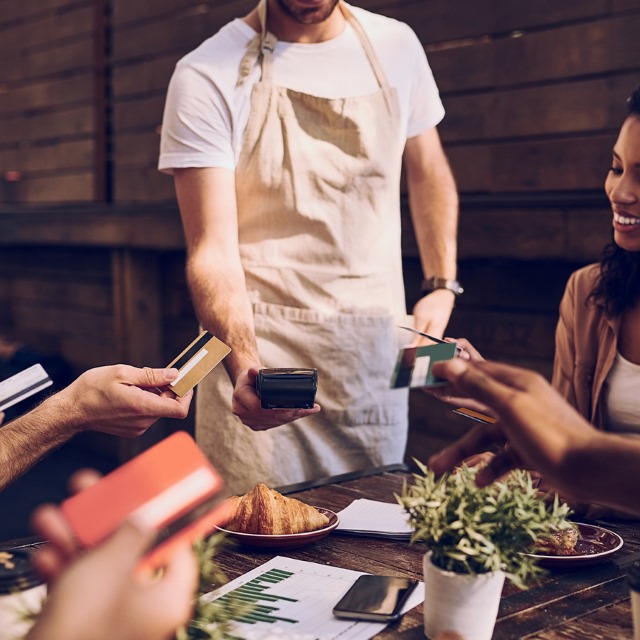 People Paying contactless around the table